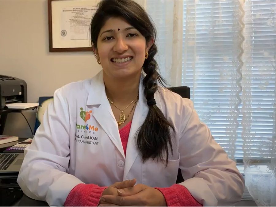 Kajal Malkan, MPAS PA-C, at her desk in the Care4Me Clinics office
